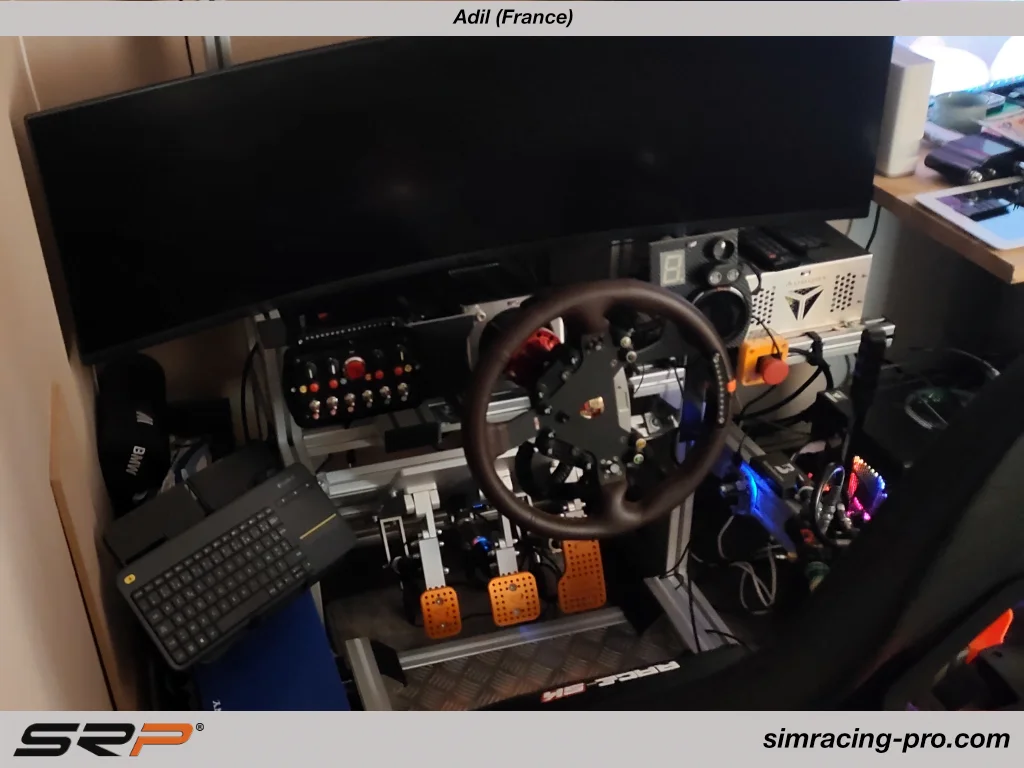 Adil France cockpit featuring original SRP GT-R inverted pedals after 6 years - durable sim racing pedals in professional simracing setup